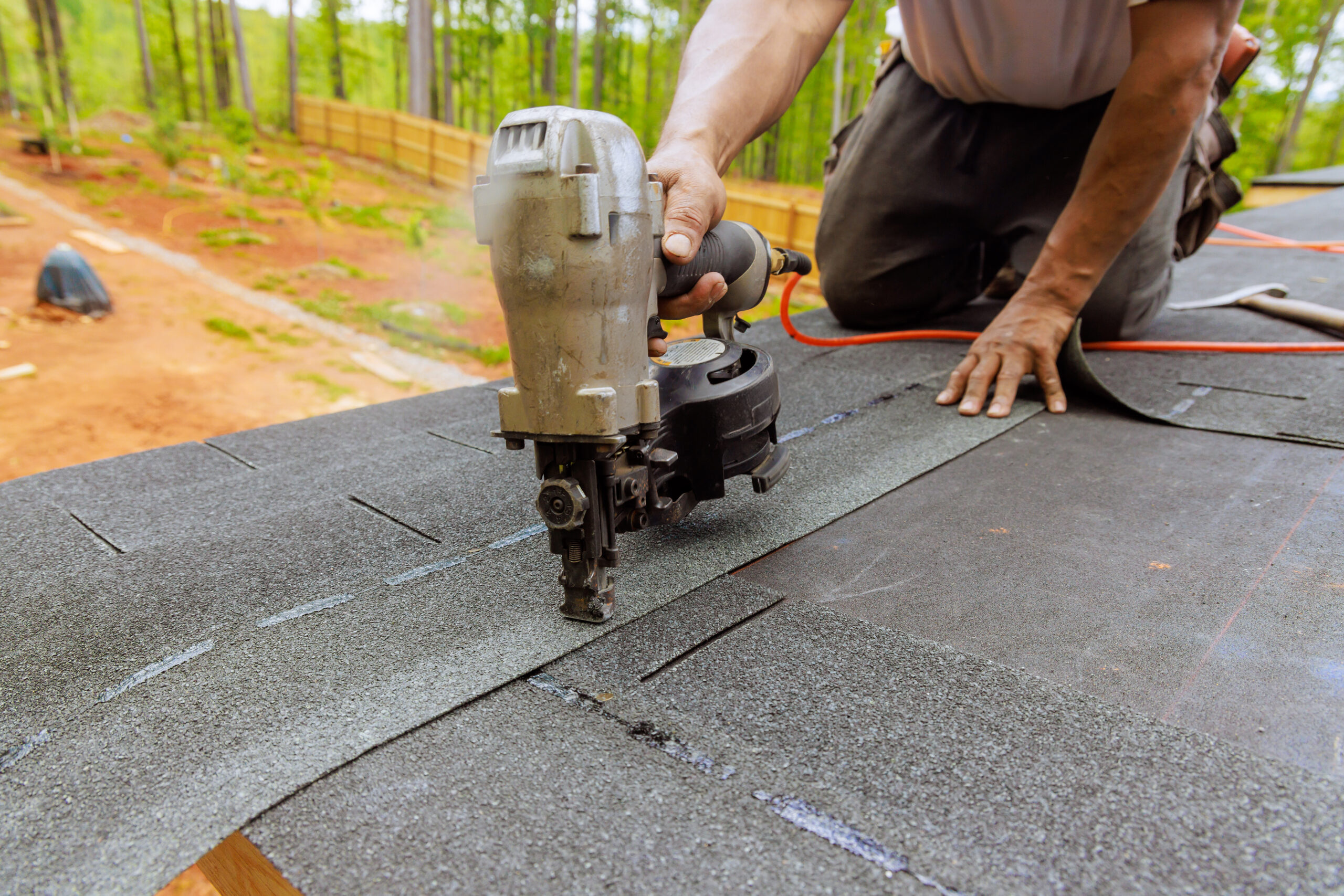 using an air pneumatic nail gun a roofer install 2024 04 29 19 13 22 utc scaled